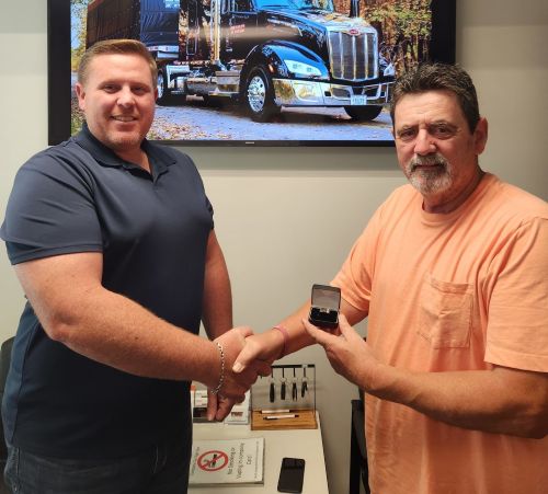 Robert Workman accepts an award for safe driving