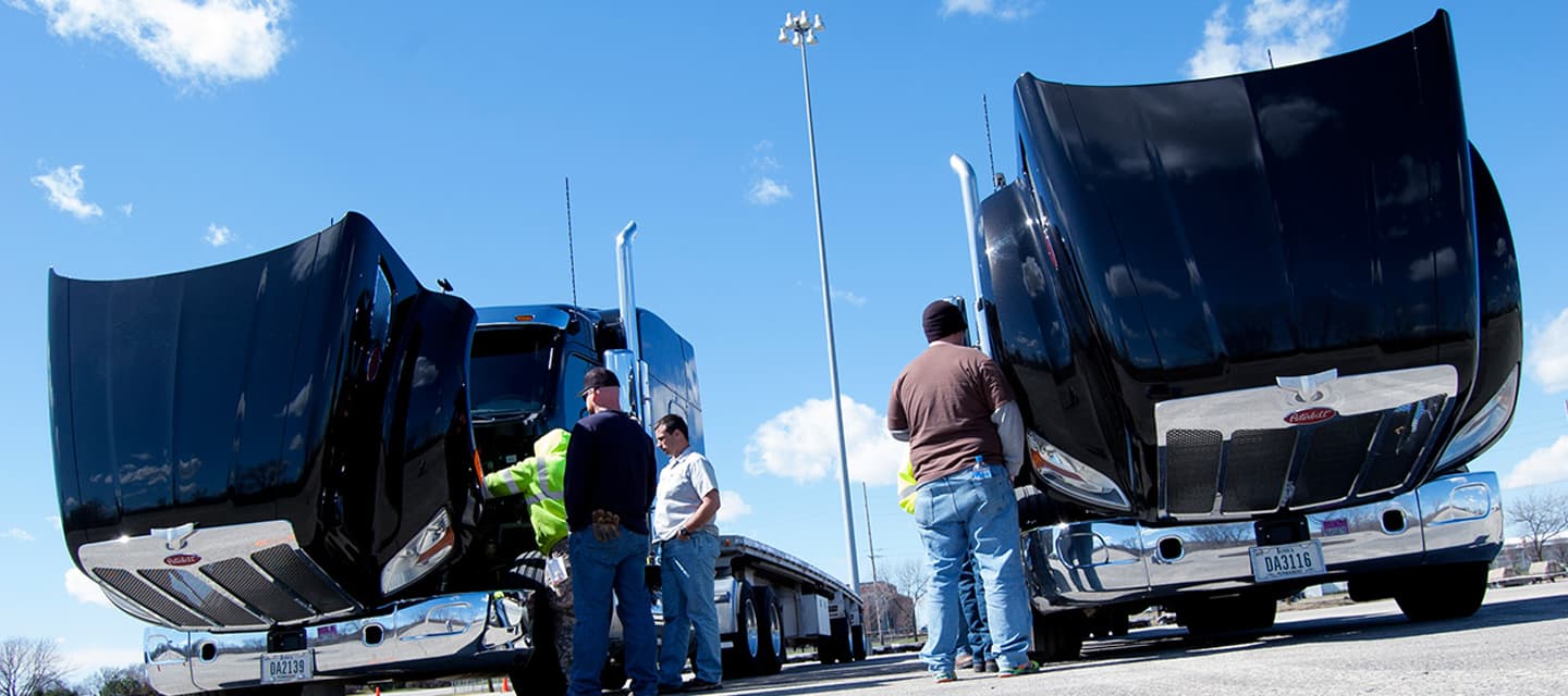 students with trainer and TMC truck